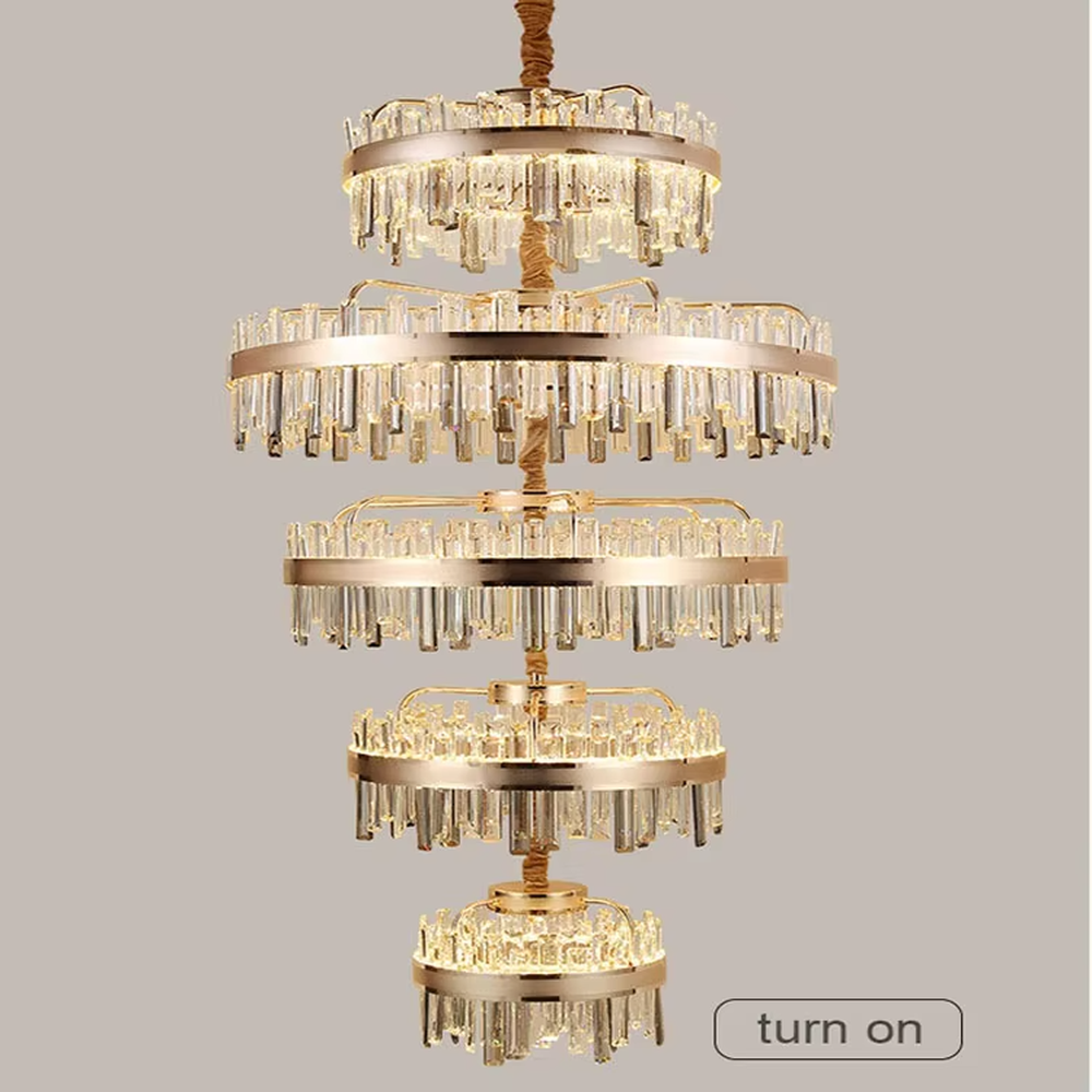 Luxurious multi-layer circular gold-frame crystal chandelier, golden metal ring frame + long crystal pendants, brilliant and gorgeous lighting, creating a high-end luxurious atmosphere.