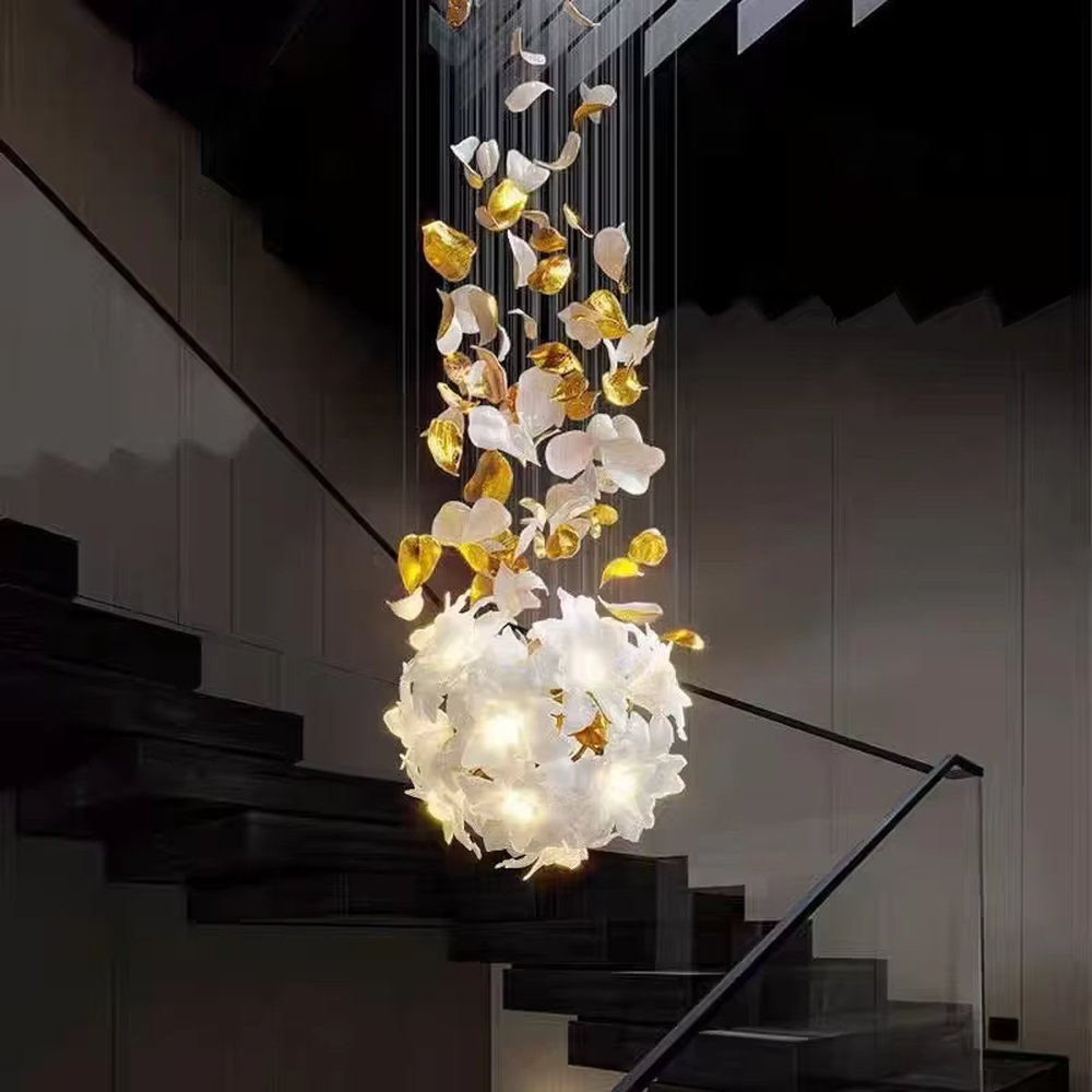 Art petal curve chandelier (white + gold gradient glass petals + metal hanging wires), warm light effect, creating a dreamy and luxurious high-ceiling space atmosphere.