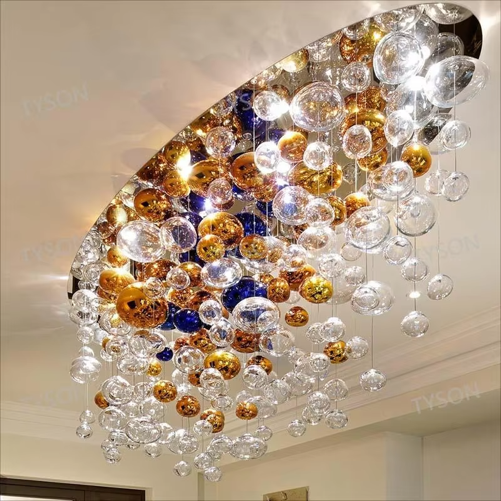 Art colorful glass ball suspension chandelier (gold/blue/transparent combination), warm light effect, creating a dreamy and brilliant luxurious space atmosphere.