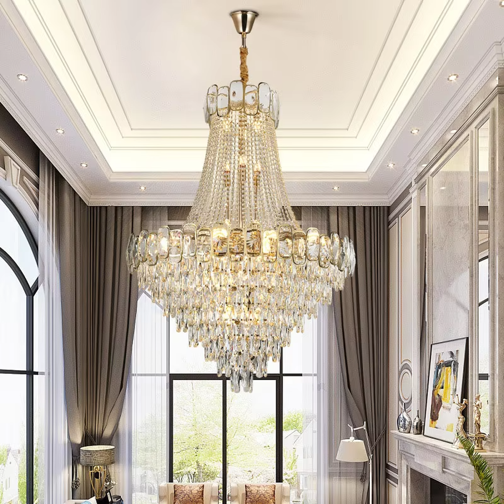 Luxurious golden double-layer crystal chandelier, upper and lower rectangular crystal decorations + crystal tassel shape, warm light presents brilliant light effect through crystals, creating a high-end luxurious space atmosphere.