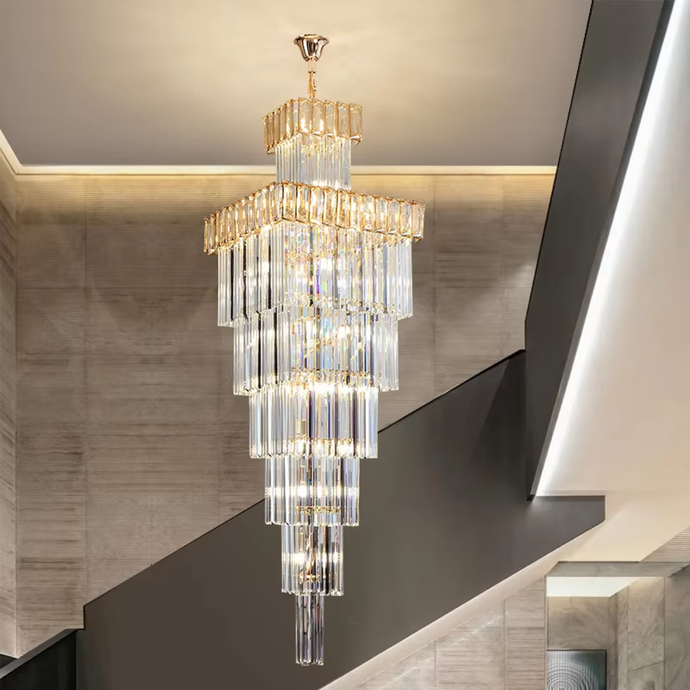 Modern light luxury multi-layer square tower-shaped golden frame crystal chandelier, warm light effect, creating an exquisite and luxurious modern space atmosphere.