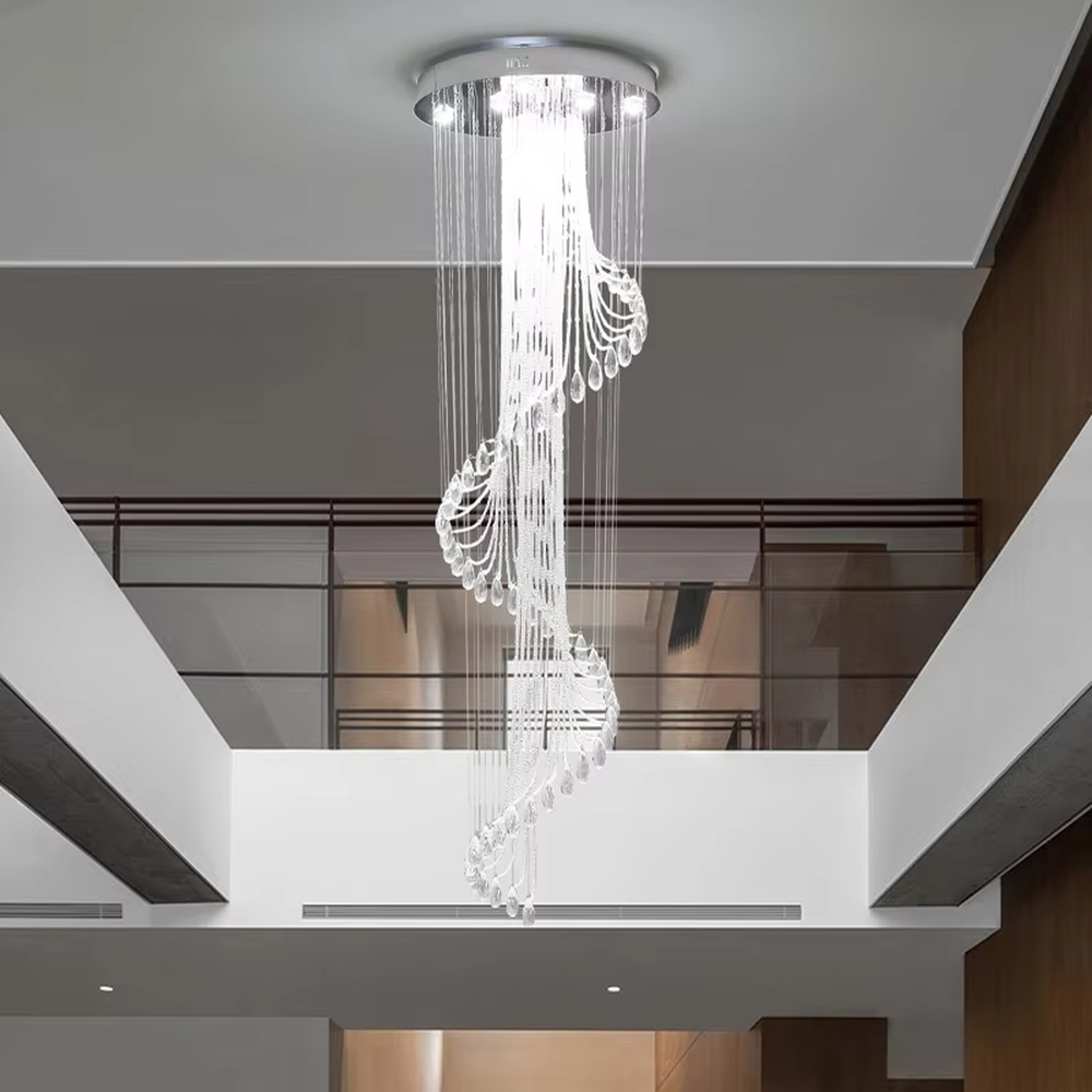 Modern art spiral transparent waterdrop crystal ceiling chandelier, silver-toned ceiling plate, warm light effect, creating a flowing artistic light luxury atmosphere.