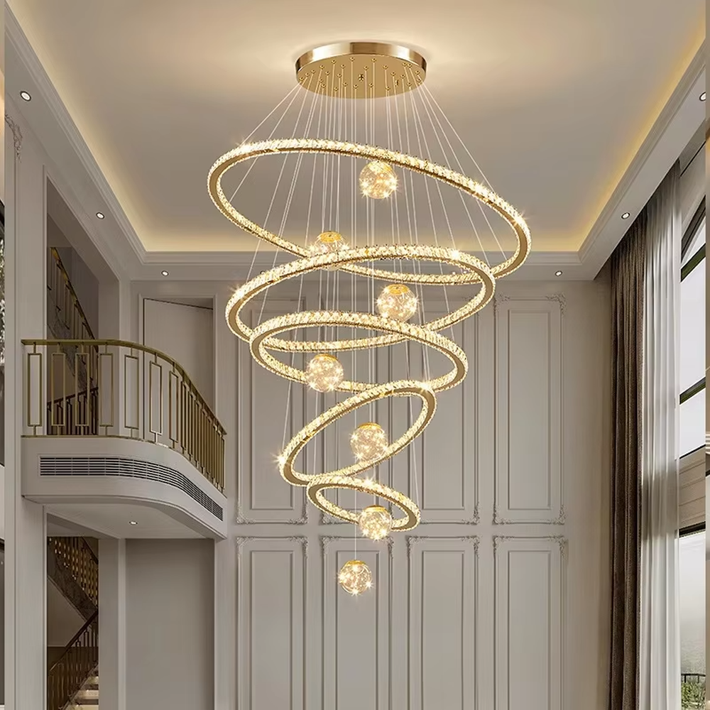 Modern top-luxury spiral ring crystal high-ceiling chandelier, golden frame + full crystal ring inlay + crystal light ball decoration + warm light effect, creating a luxurious artistic atmosphere in high-ceiling spaces.
