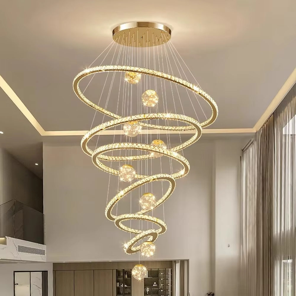 Modern top-luxury spiral ring crystal high-ceiling chandelier, golden frame + full crystal ring inlay + crystal light ball decoration + warm light effect, creating a luxurious artistic atmosphere in high-ceiling spaces.