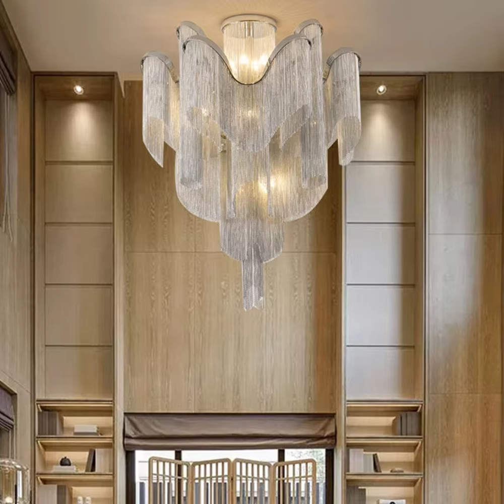 Luxury multi-layer tassel crystal chandelier (gradient crystal tassels + metal frame), warm light effect, creating a magnificent and luxurious high-ceiling space atmosphere.