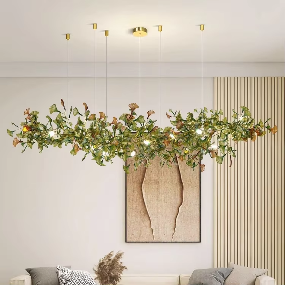 Art ginkgo leaf vine chandelier (simulated ginkgo leaves + built-in light source + drooping vine shape), warm light effect, creating a natural forest-style high-ceiling space atmosphere.