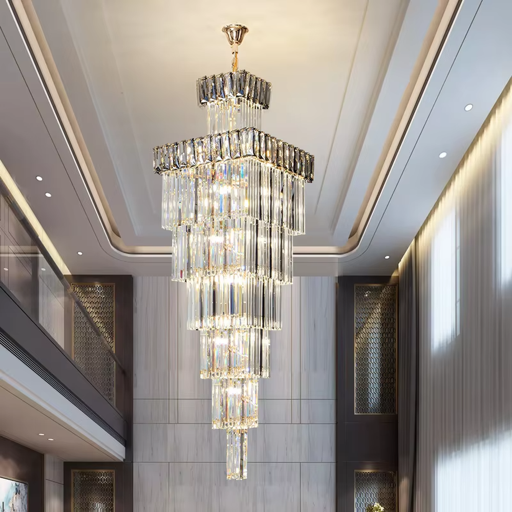 Modern light luxury multi-layer square tower-shaped golden frame crystal chandelier, warm light effect, creating an exquisite and luxurious modern space atmosphere.