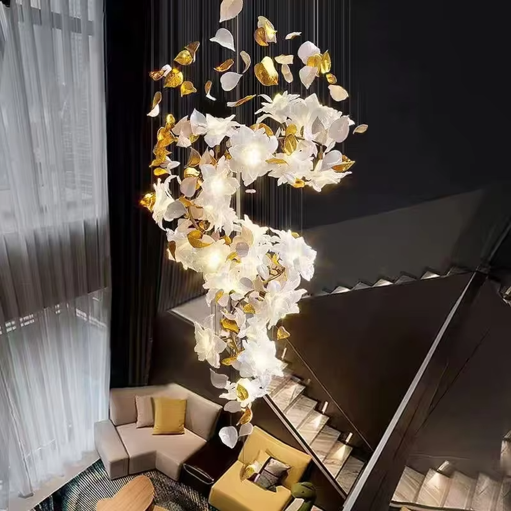 Art petal curve chandelier (white + gold gradient glass petals + metal hanging wires), warm light effect, creating a dreamy and luxurious high-ceiling space atmosphere.