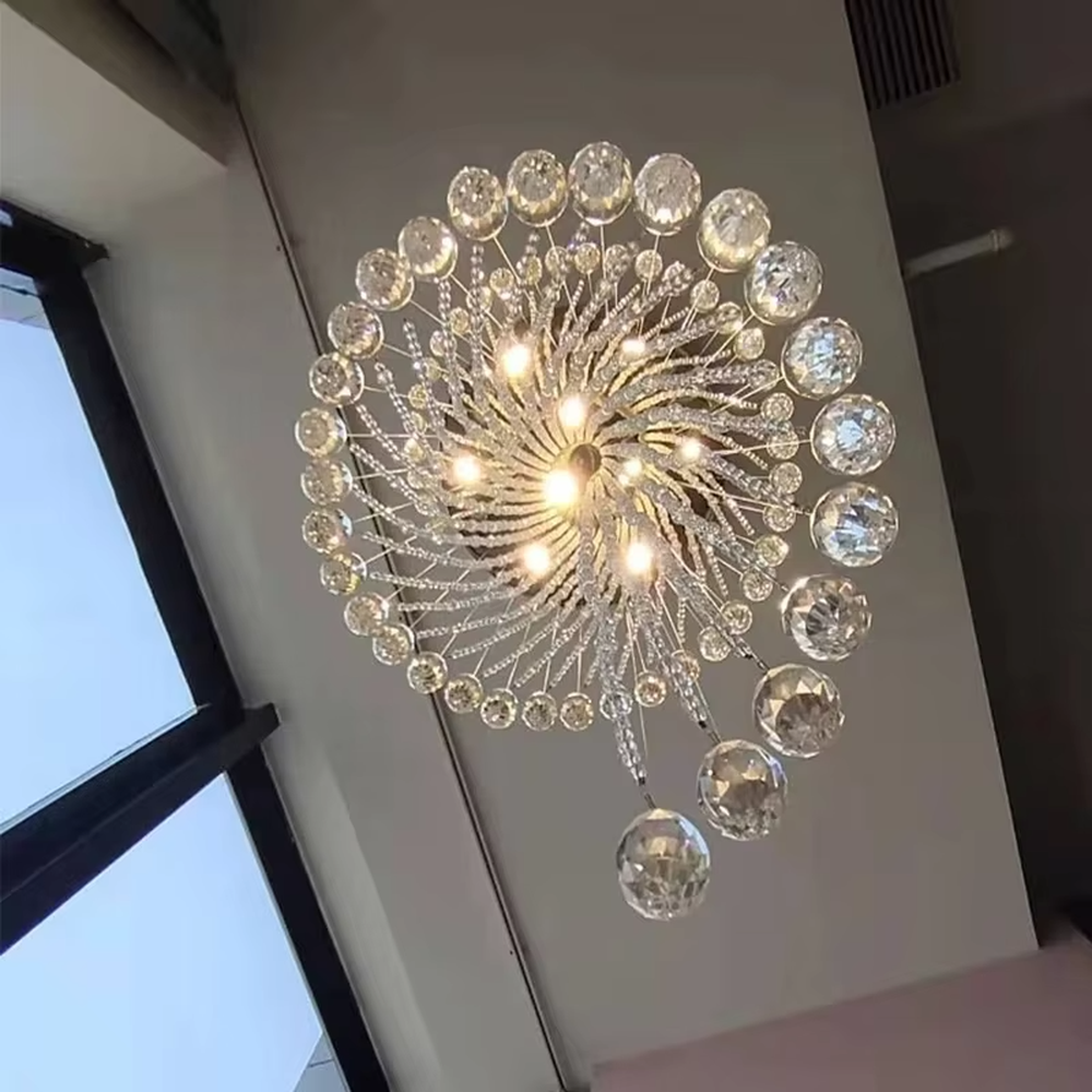 Modern art spiral transparent waterdrop crystal ceiling chandelier, silver-toned ceiling plate, warm light effect, creating a flowing artistic light luxury atmosphere.