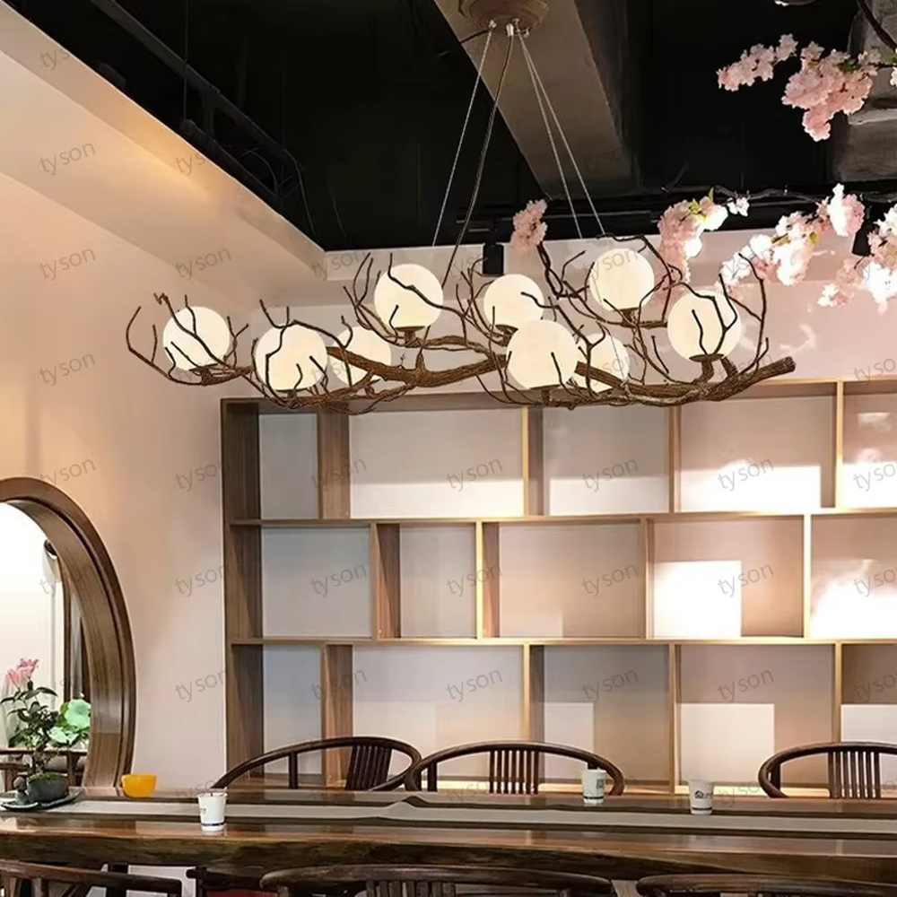 Natural dry branch glass ball chandelier (simulated dry branch frame + milk-white glass balls), warm light effect, creating a forest-style healing space atmosphere.