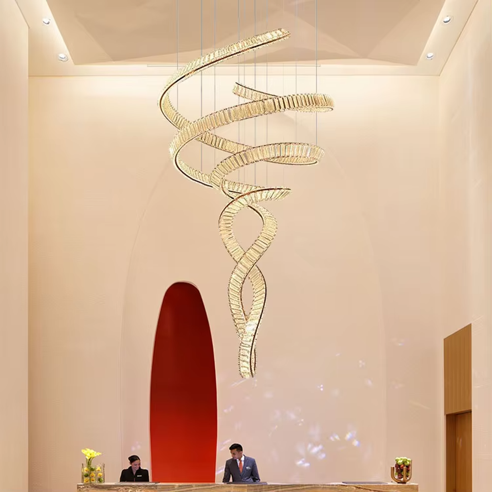 Modern art light luxury spiral curve golden crystal high-ceiling chandelier, textured crystal material + flexible curve design + warm light effect, creating a luxurious artistic atmosphere.