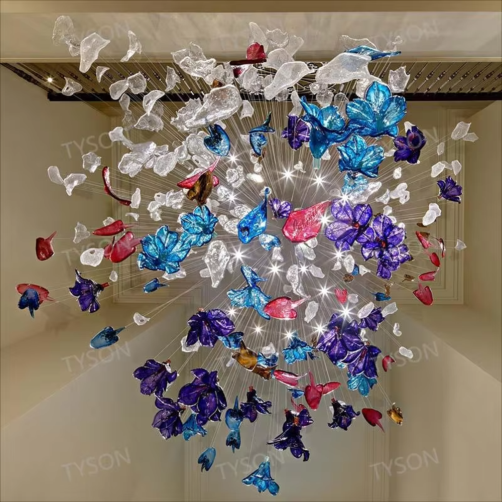 Art Firework Colored Glass Chandelier (blue-purple-red transparent glass petals + radial metal wire frame), warm and cool light effect, creating a bright and dreamy high-end space atmosphere.
