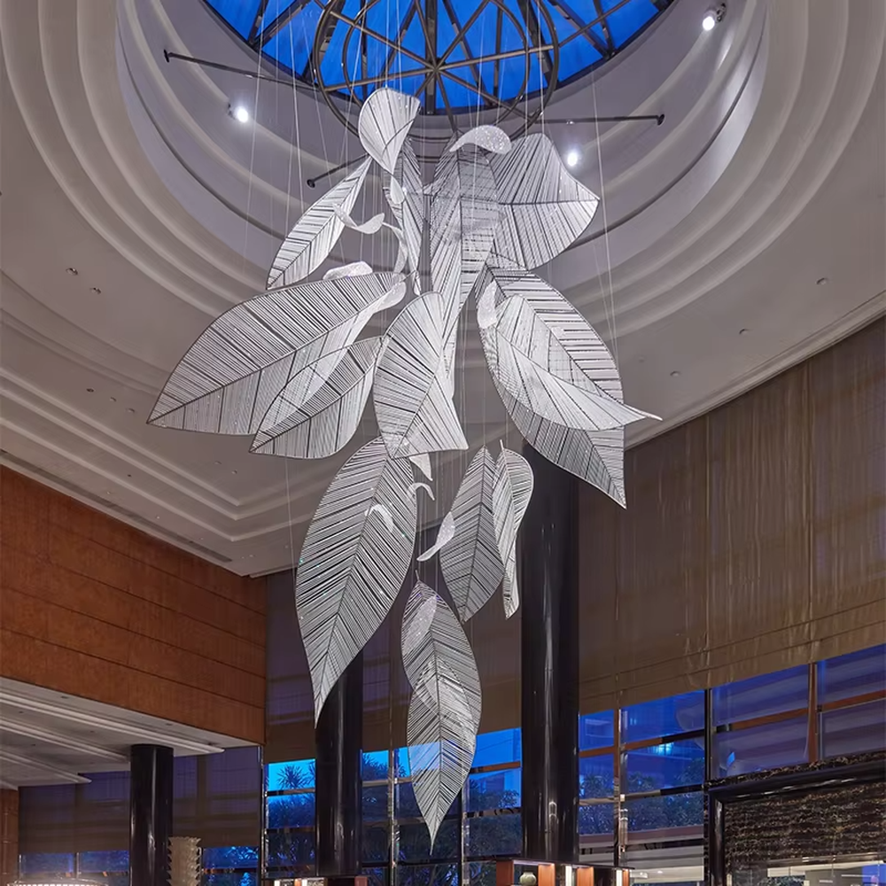 Inspired by "natural leaf veins", this chandelier features layered leaf structures made of translucent acrylic/crystal material, with delicate textures like real veins. The pendant layout mimics the natural drooping form of leaves, and light refracts soft and warm light and shadow through the material. It is both a space lighting tool and a visually striking art installation, infusing high-end venues with a natural and elegant artistic style.