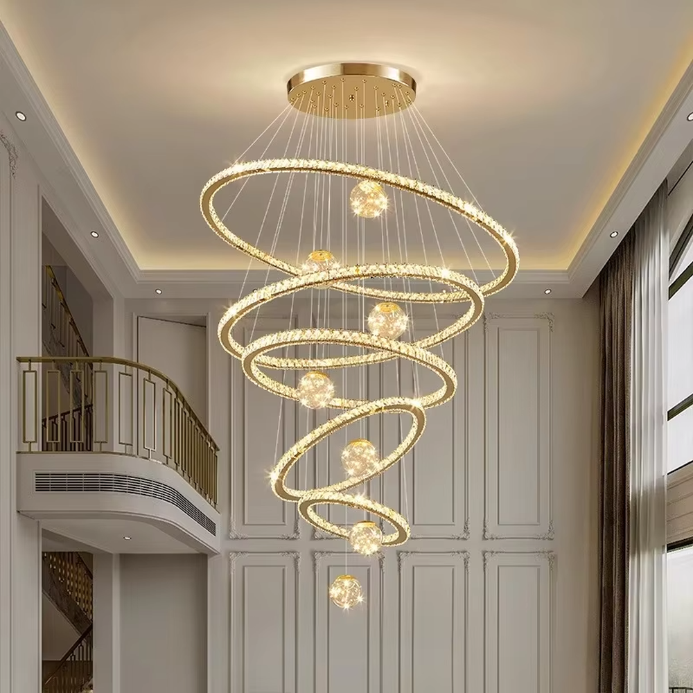 Modern top-luxury spiral ring crystal high-ceiling chandelier, golden frame + full crystal ring inlay + crystal light ball decoration + warm light effect, creating a luxurious artistic atmosphere in high-ceiling spaces.