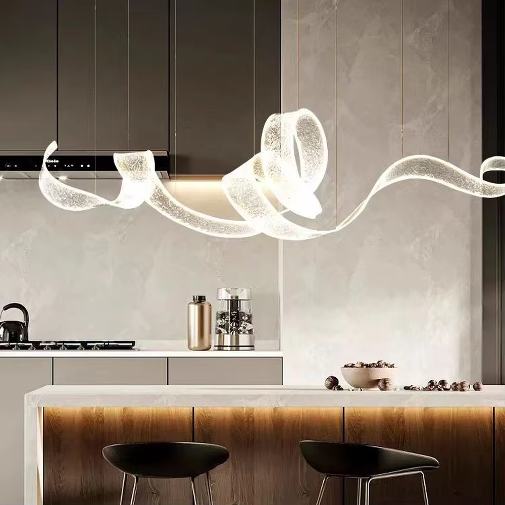 Art ribbon curve chandelier (transparent texture acrylic + flowing shape), warm light effect, creating a minimalist artistic space atmosphere.