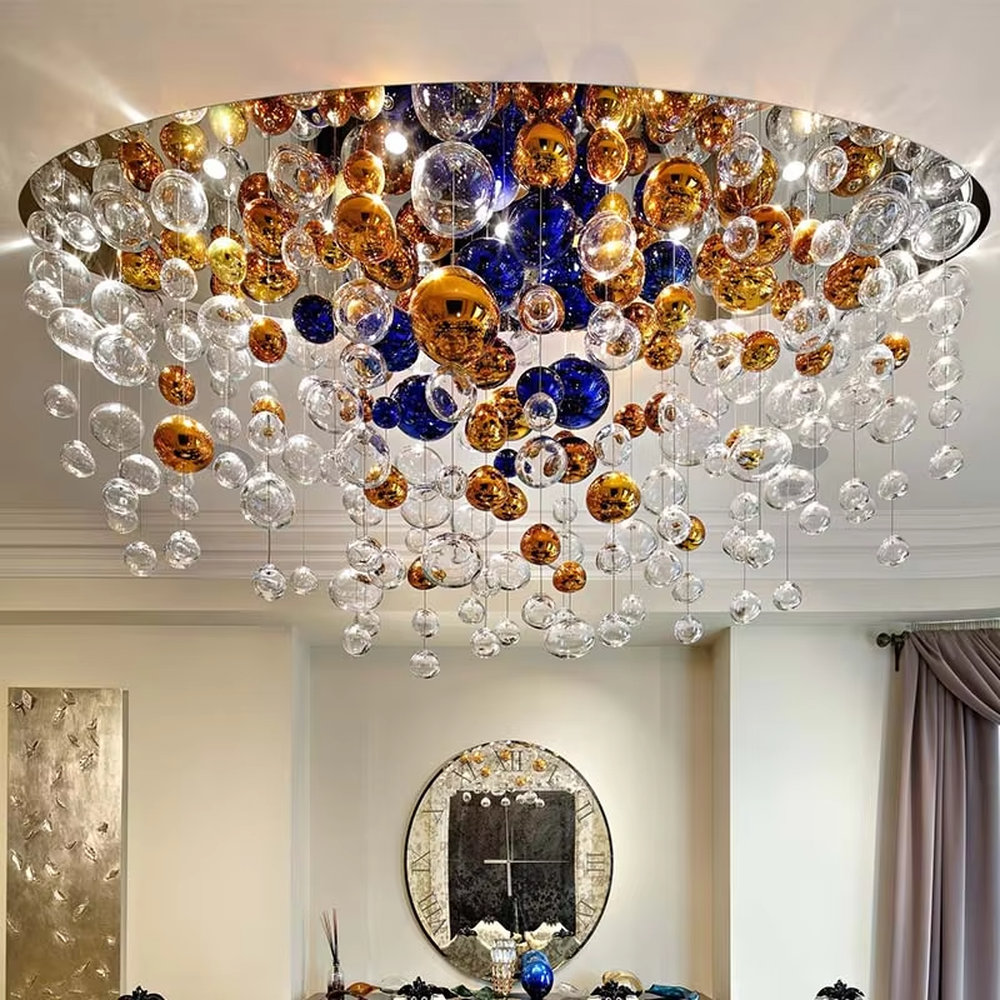 Art colorful glass ball suspension chandelier (gold/blue/transparent combination), warm light effect, creating a dreamy and brilliant luxurious space atmosphere.