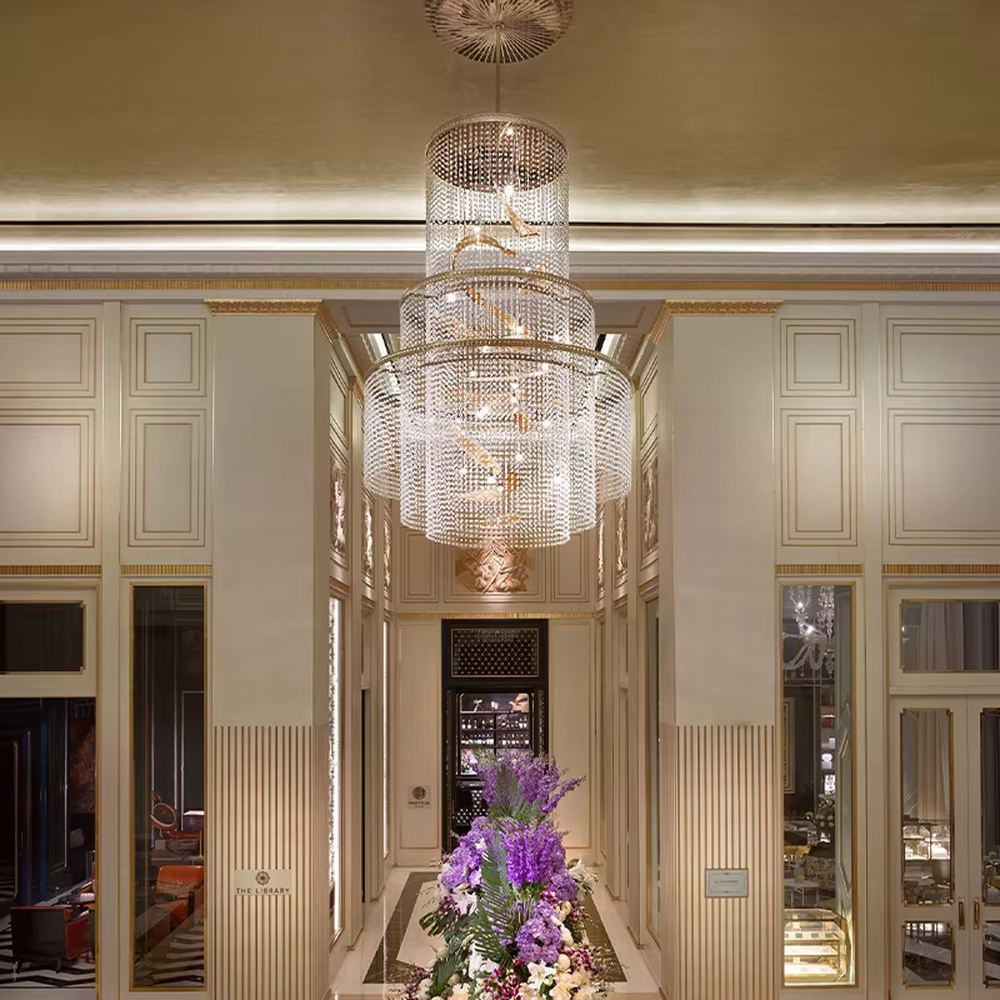 Luxury multi-layer crystal chandelier (spiral gold accessories + full-set crystals), warm light effect, creating a luxurious and elegant high-end space atmosphere.