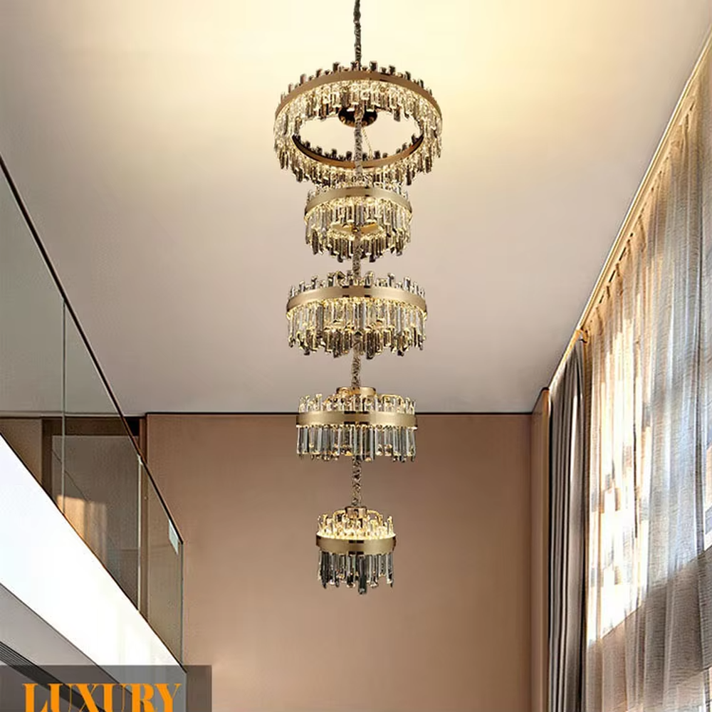 Modern luxurious multi-layer circular golden frame long crystal chandelier, warm light effect, creating a high-end artistic space atmosphere.
