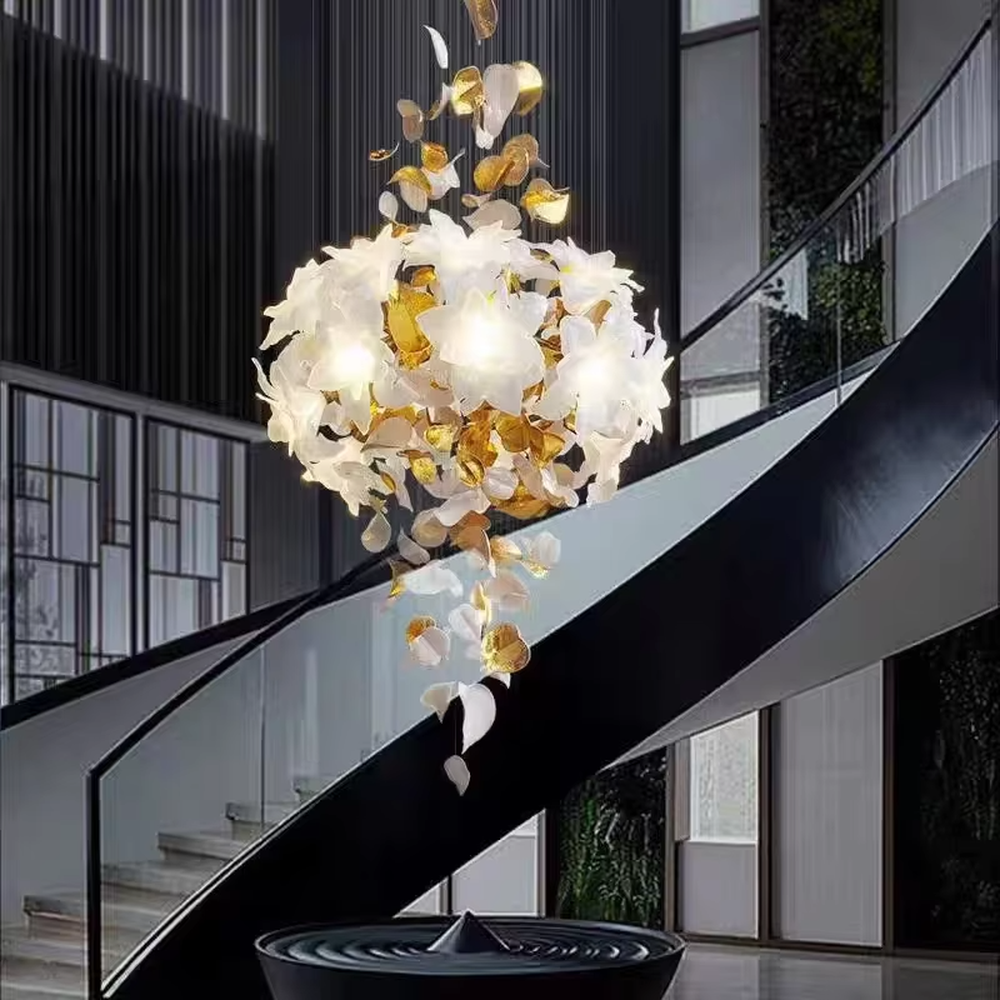 Art petal curve chandelier (white + gold gradient glass petals + metal hanging wires), warm light effect, creating a dreamy and luxurious high-ceiling space atmosphere.