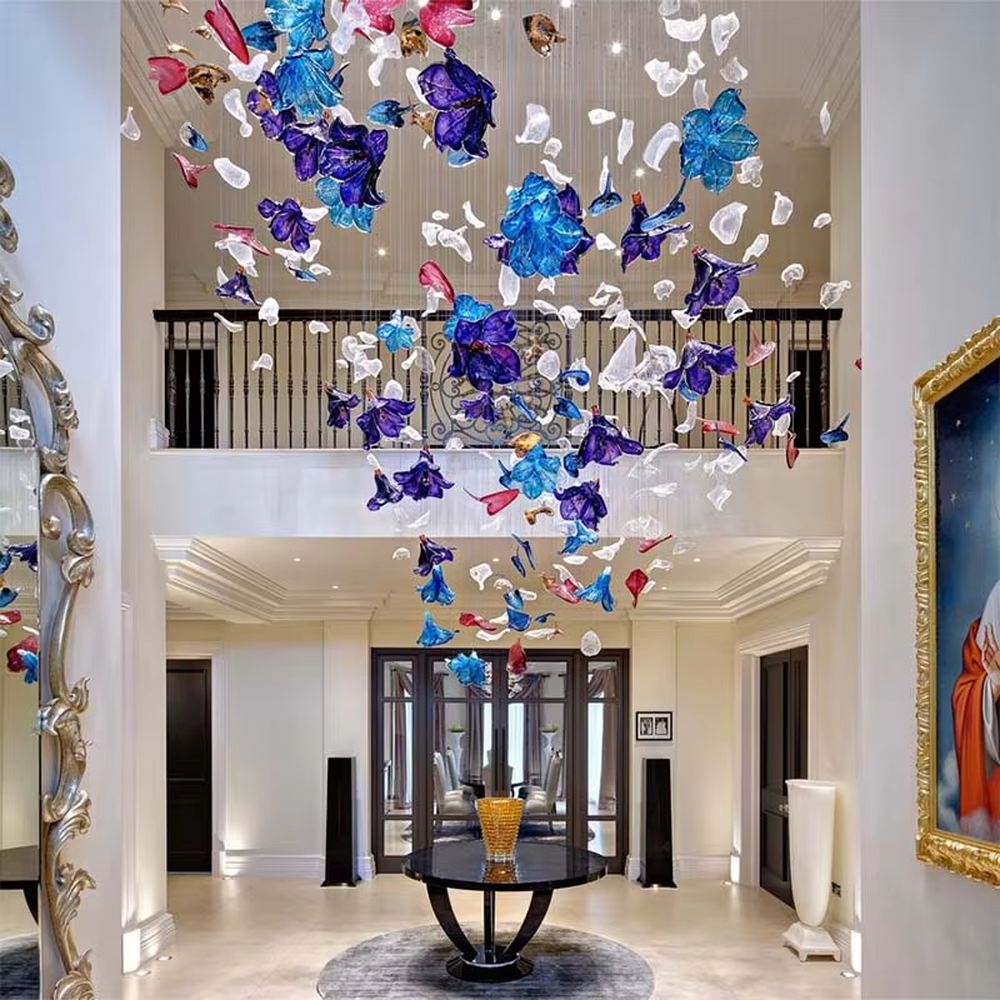 Art Firework Colored Glass Chandelier (blue-purple-red transparent glass petals + radial metal wire frame), warm and cool light effect, creating a bright and dreamy high-end space atmosphere.
