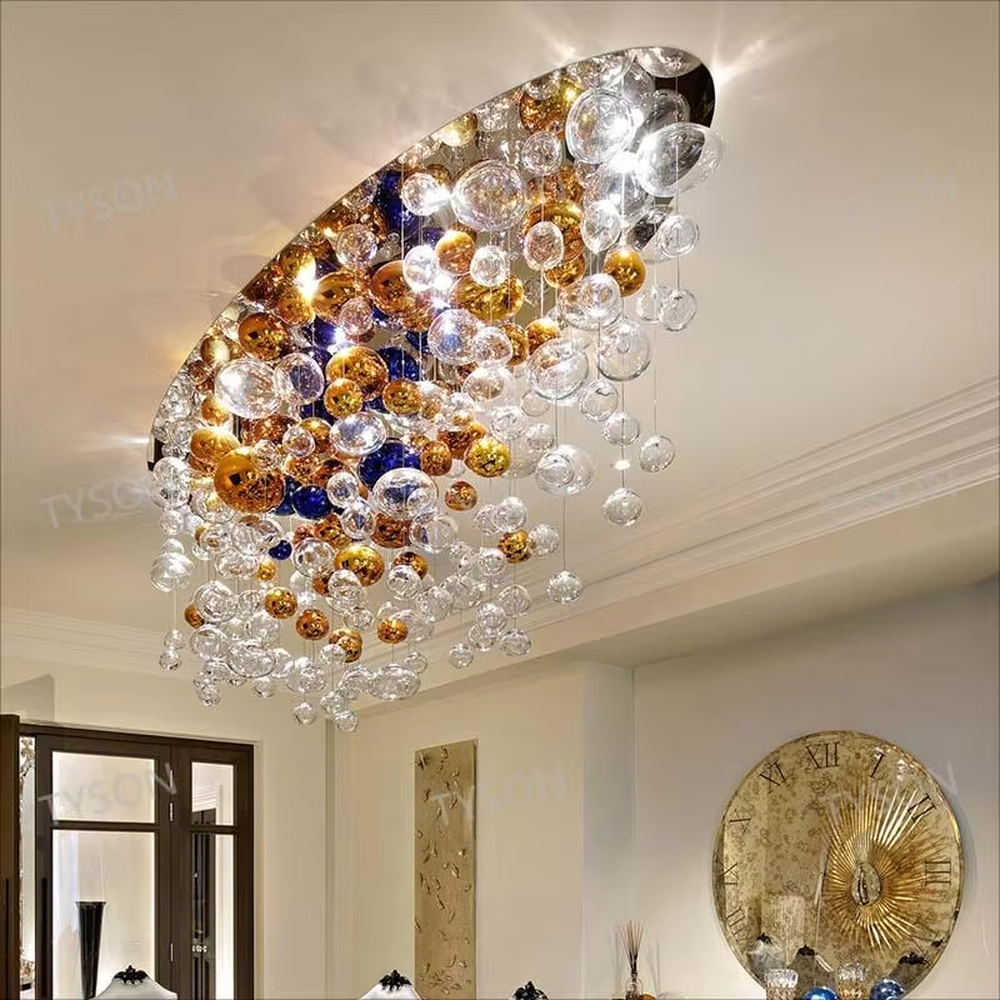 Art colorful glass ball suspension chandelier (gold/blue/transparent combination), warm light effect, creating a dreamy and brilliant luxurious space atmosphere.