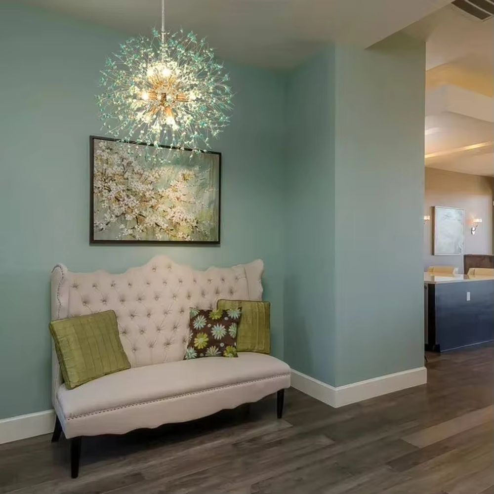 This modern light luxury dandelion-shaped chandelier features a gold metal core frame, paired with blue-green gradient crystal/acrylic decorations, in a radial blooming shape. It serves both lighting and decorative purposes, ideal for living rooms, entryways, light luxury commercial spaces and other scenarios.