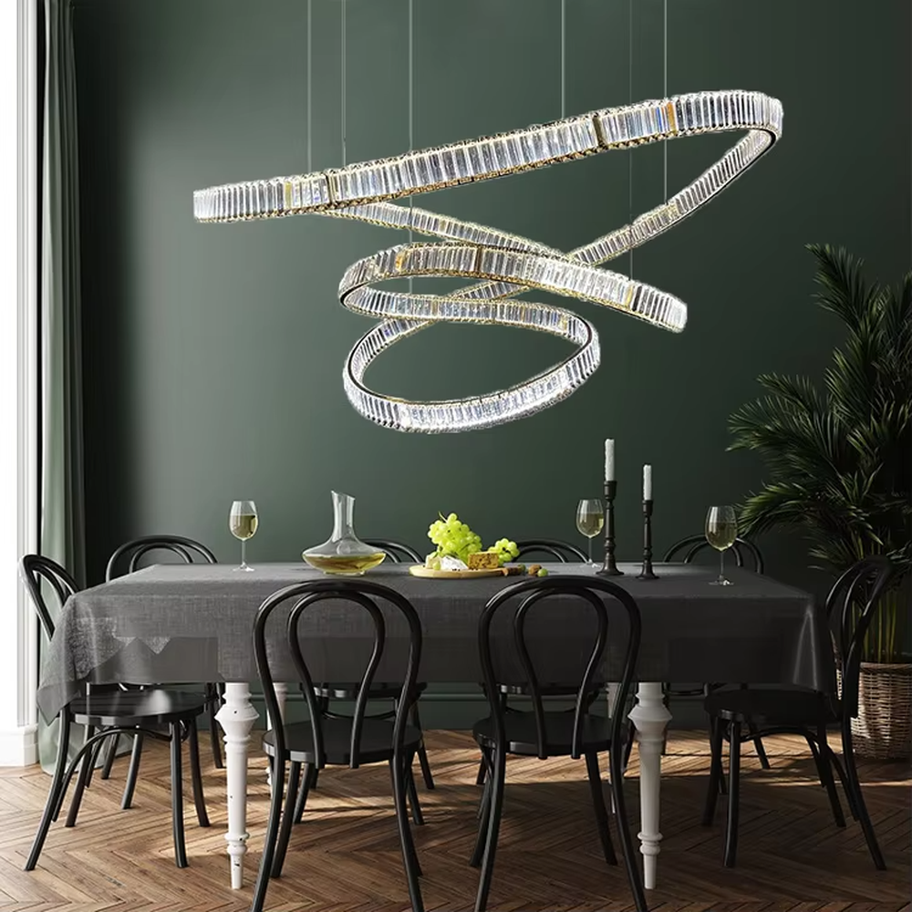 Modern art light luxury spiral curve golden crystal high-ceiling chandelier, textured crystal material + flexible curve design + warm light effect, creating a luxurious artistic atmosphere.