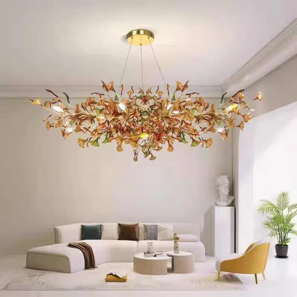 Art Ginkgo Leaf Light Luxury Chandelier (orange-yellow gradient glass leaves + gold metal frame), warm light effect, creating a natural and elegant atmosphere in large flat-floor living rooms.