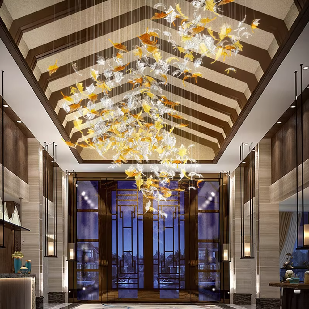 Modern art large chandelier, with leaf-shaped glass/acrylic in white to yellow-orange gradient as the main body, hanging in a suspended staggered manner, emitting transparent and brilliant light, combining artistic decorativeness and lighting function, suitable for core decoration and main lighting in large high-end spaces such as hotel lobbies, high-end clubs, and sales offices.
