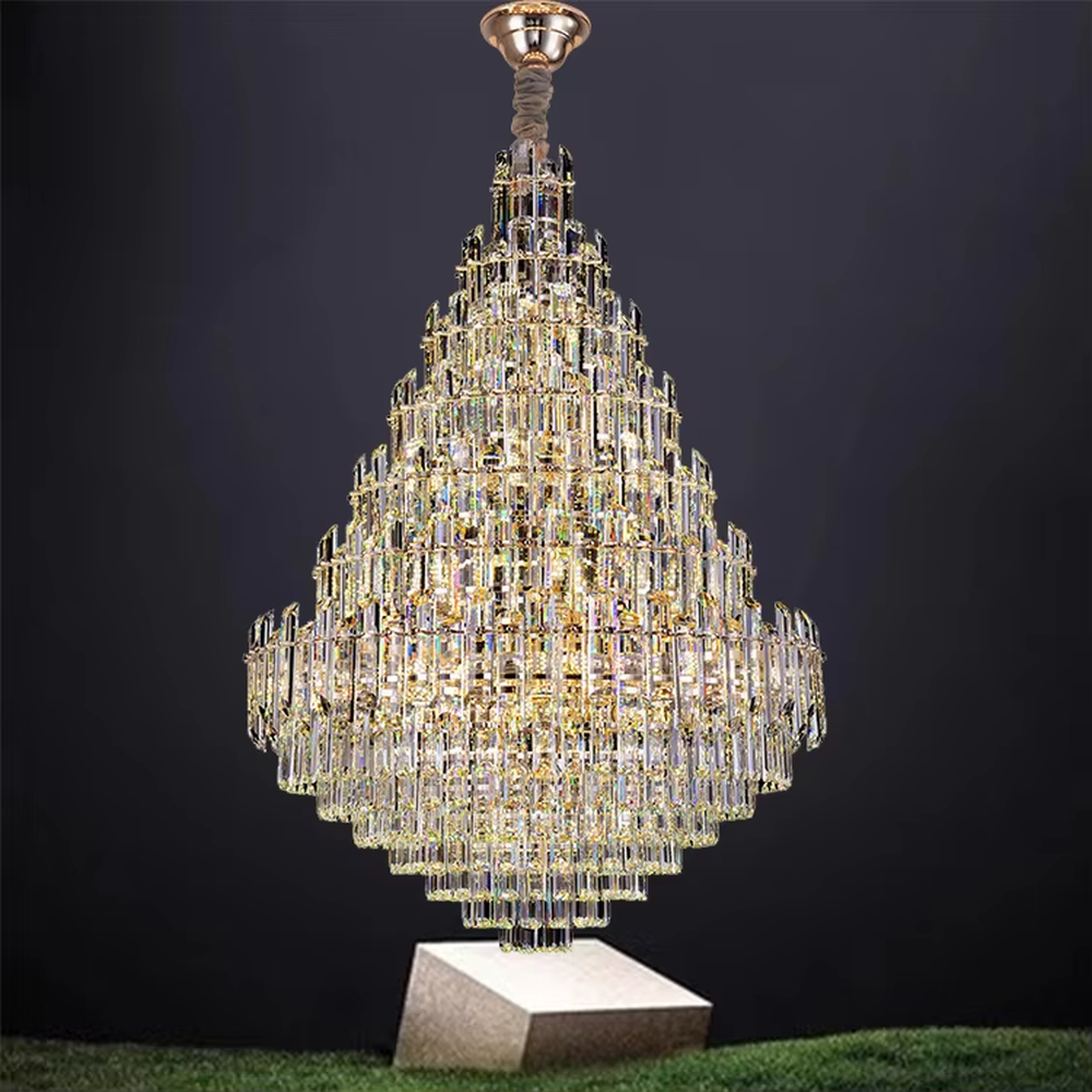 This is an European-style luxurious teardrop-shaped crystal chandelier, featuring a pyramid shape crafted from multi-layer dense crystal strips, emitting brilliant and gorgeous light, serving both lighting and decorative purposes, suitable for villa high-ceiling living rooms, hotel lobbies, banquet halls, high-end clubs and other scenarios.
