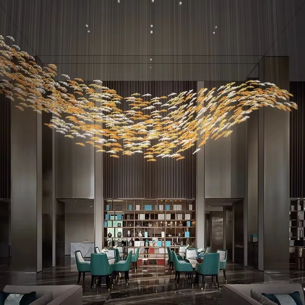 Art bird-shaped chandelier (gold-white gradient birds + warm light), warm light effect, creating a dynamic and natural atmosphere for high-end public spaces.