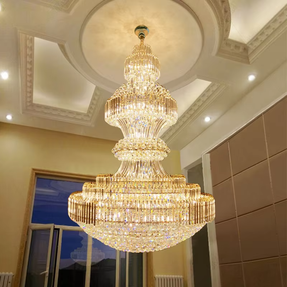 Multi-tiered golden crystal chandelier, with cascading crystal pendants and a gold metal frame, providing brilliant and luxurious light, designed to create a high-end and grand space atmosphere, suitable for engineering scenarios such as hotel lobbies, high-ceiling villa living rooms, and large banquet halls
