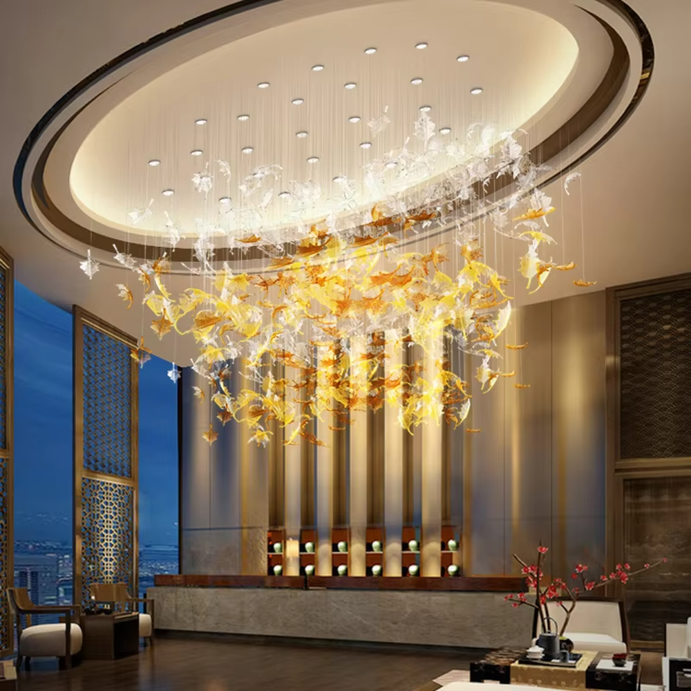 Modern art large chandelier, with leaf-shaped glass/acrylic in white to yellow-orange gradient as the main body, hanging in a suspended staggered manner, emitting transparent and brilliant light, combining artistic decorativeness and lighting function, suitable for core decoration and main lighting in large high-end spaces such as hotel lobbies, high-end clubs, and sales offices.
