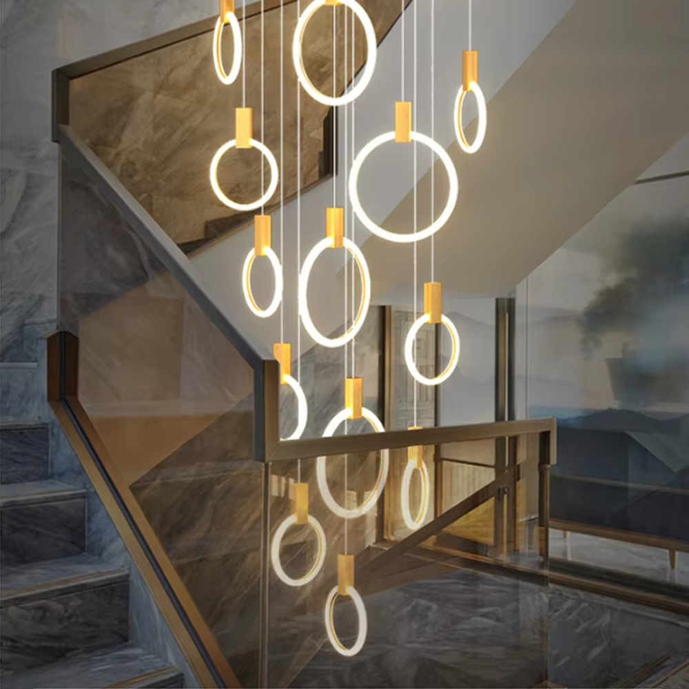 Minimalist ring tiered chandelier (gold accessory + white ring + warm light), warm light effect, creating a modern and high-end space atmosphere.