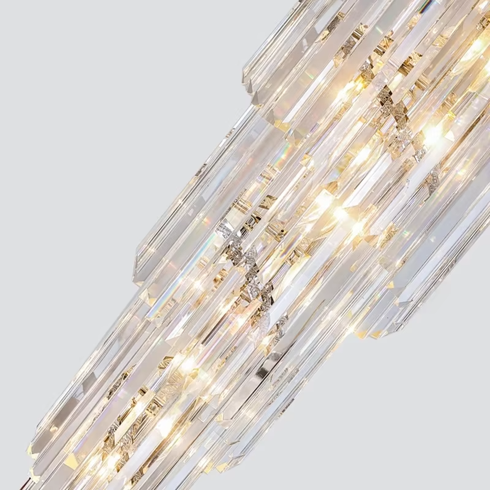 This is an European-style luxurious long cone-shaped crystal chandelier, featuring a pagoda-style structure crafted from multi-layer dense crystal strips, emitting brilliant and gorgeous light, serving both lighting and decorative purposes, suitable for villa high-ceiling staircases, duplex void living rooms, hotel lobbies and other scenarios.