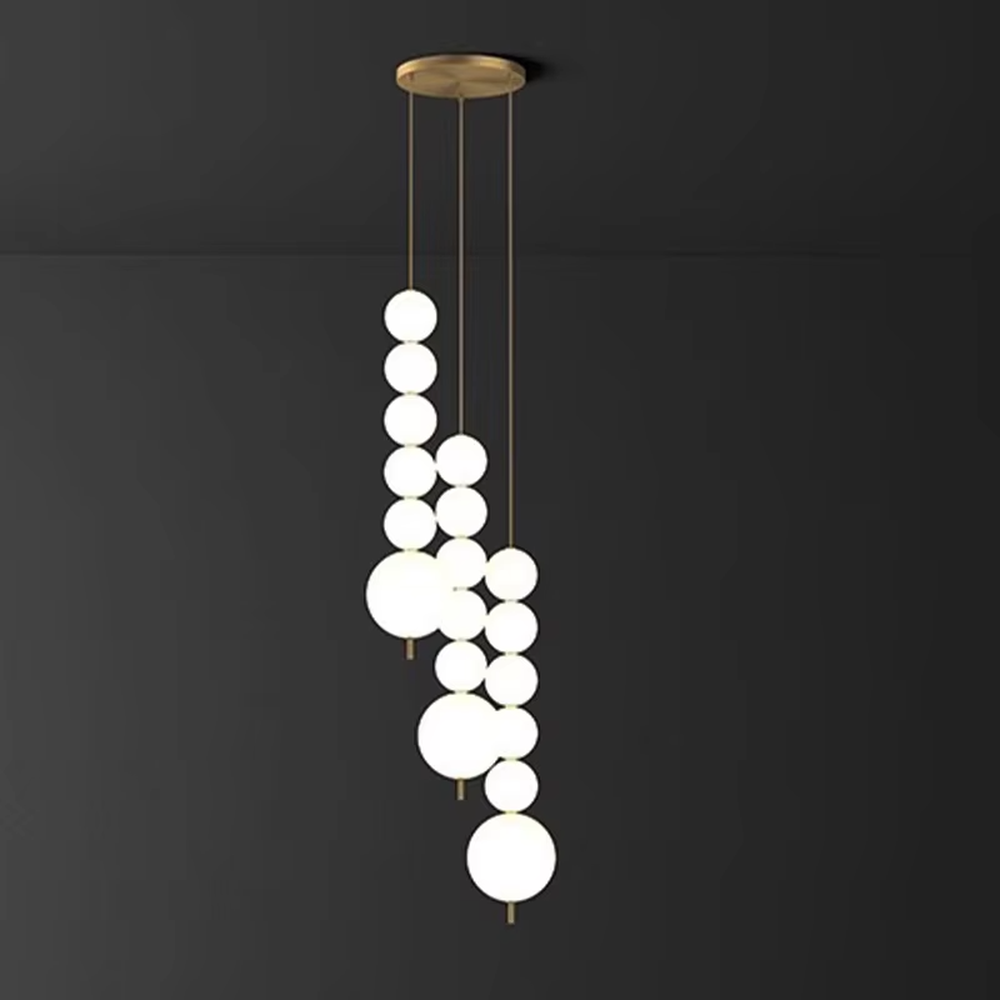 Modern light luxury double-strip spherical cascading chandelier, with a gold metal top plate paired with two strips of milky white luminous bulbs hanging staggered, emitting soft and even light, combining decorativeness and practicality, suitable for core lighting and atmosphere creation in spaces such as dining rooms, high-ceiling living rooms, and duplex stairs.