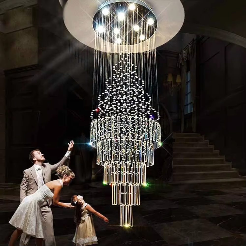 European luxury waterfall-style crystal chandelier, composed of multi-layer crystal columns and particles in a cascading structure, paired with a silver metal frame. It emits brilliant and transparent light, combining artistic decorativeness and lighting function, suitable for core lighting and atmosphere creation in high-ceiling spaces such as villa high-ceiling living rooms, hotel lobbies, and high-end clubs.