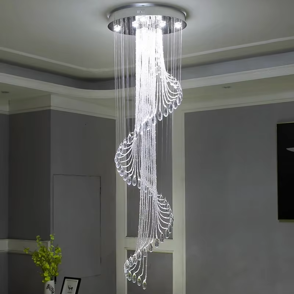 This is a modern light luxury style artistic crystal chandelier, composed of multiple layers of transparent crystal strings and teardrop-shaped crystal pendants. Its streamlined shape resembles a flowing waterfall of light, serving both lighting and artistic decoration purposes, suitable for high-ceiling spaces such as villa high-ceiling living rooms, duplex voids, hotel lobbies, and high-end clubs.