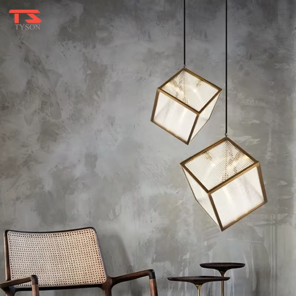 This light luxury minimalist cube chandelier features a gold metal frame with an embedded light-transmitting grid lampshade, using a floating suspension design, with a simple and exquisite shape, serving both lighting and decorative purposes, ideal for dining rooms, living rooms, modern light luxury homes and other scenarios.