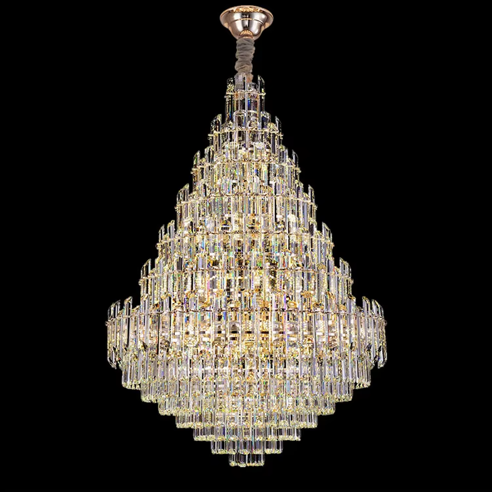 This is an European-style luxurious teardrop-shaped crystal chandelier, featuring a pyramid shape crafted from multi-layer dense crystal strips, emitting brilliant and gorgeous light, serving both lighting and decorative purposes, suitable for villa high-ceiling living rooms, hotel lobbies, banquet halls, high-end clubs and other scenarios.
