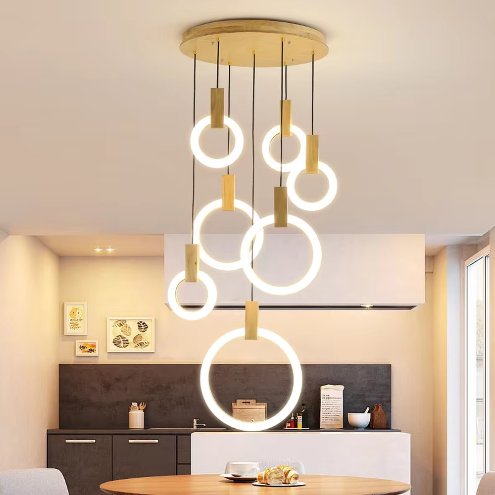 Minimalist ring tiered chandelier (gold accessory + white ring + warm light), warm light effect, creating a modern and high-end space atmosphere.