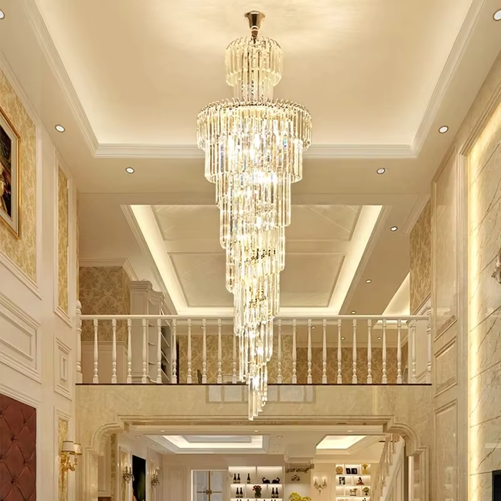 This is an European-style luxurious long cone-shaped crystal chandelier, featuring a pagoda-style structure crafted from multi-layer dense crystal strips, emitting brilliant and gorgeous light, serving both lighting and decorative purposes, suitable for villa high-ceiling staircases, duplex void living rooms, hotel lobbies and other scenarios.