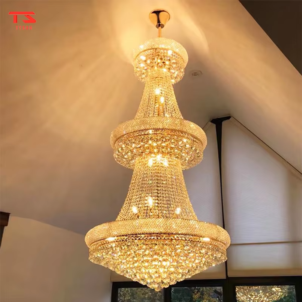Multi-tiered tower-shaped golden crystal chandelier, with multi-layer dense crystal pendants and gold metal frames, providing brilliant and luxurious light, designed to create a high-end and grand space atmosphere, suitable for high-ceiling engineering scenarios such as villa high-ceiling living rooms, duplex buildings, hotel lobbies, and clubs
