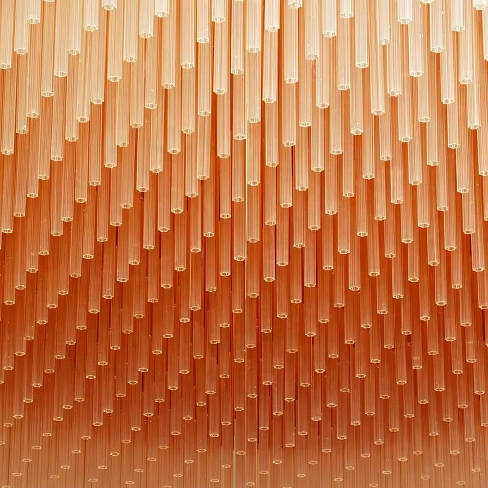 Art gradient striped crystal chandelier (transparent white + warm orange combination), warm light effect, creating a magnificent artistic high-end space atmosphere.