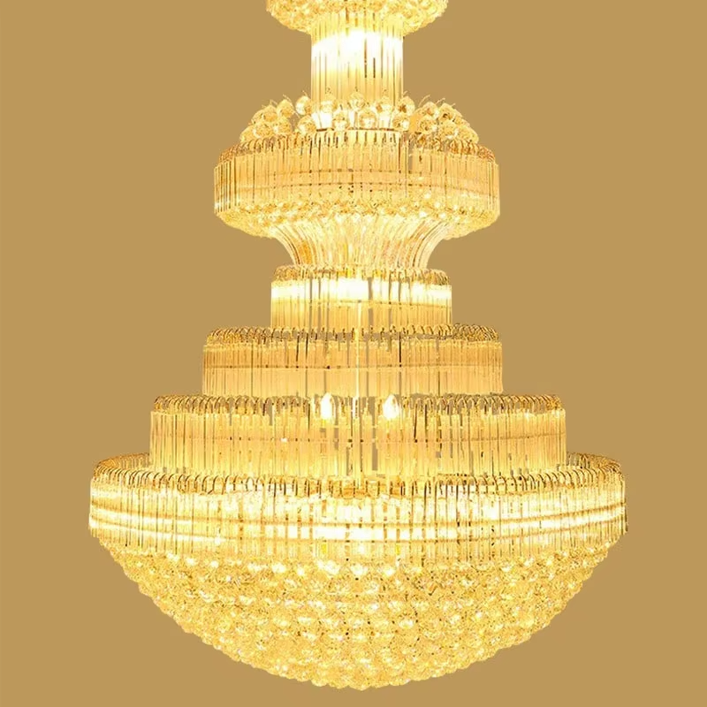 Multi-tiered golden crystal chandelier, with cascading crystal pendants and a gold metal frame, providing brilliant and luxurious light, designed to create a high-end and grand space atmosphere, suitable for engineering scenarios such as hotel lobbies, high-ceiling villa living rooms, and large banquet halls