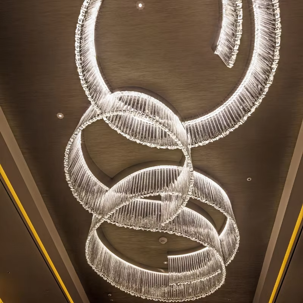 Light luxury ring gradient crystal strip engineering chandelier, transparent crystal strips hanging to create a multi-layer nested ring shape, with transparent and brilliant light, designed to enhance the luxurious atmosphere of high-end spaces, suitable for high-ceiling engineering scenarios such as hotel lobbies, club reception halls, and high-end showrooms
