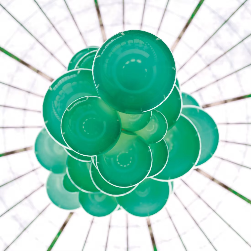 Artistic grape-cluster shaped chandelier, composed of hand-blown glass balls in a deep purple to black gradient, arranged in a cascading stacked structure. Light passes through the glass balls to create a transparent and brilliant effect, combining artistic decorativeness and lighting function, suitable for core decoration and ambient lighting in high-ceiling spaces such as duplex stairs, high-end clubs, and villa living rooms.
