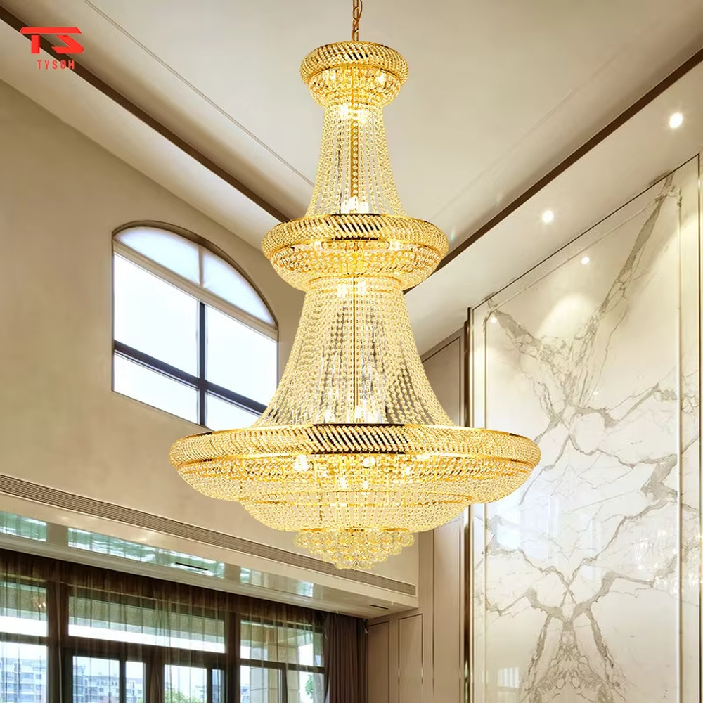 Multi-tiered tower-shaped golden crystal chandelier, with multi-layer dense crystal pendants and gold metal frames, providing brilliant and luxurious light, designed to create a high-end and grand space atmosphere, suitable for high-ceiling engineering scenarios such as villa high-ceiling living rooms, duplex buildings, hotel lobbies, and clubs