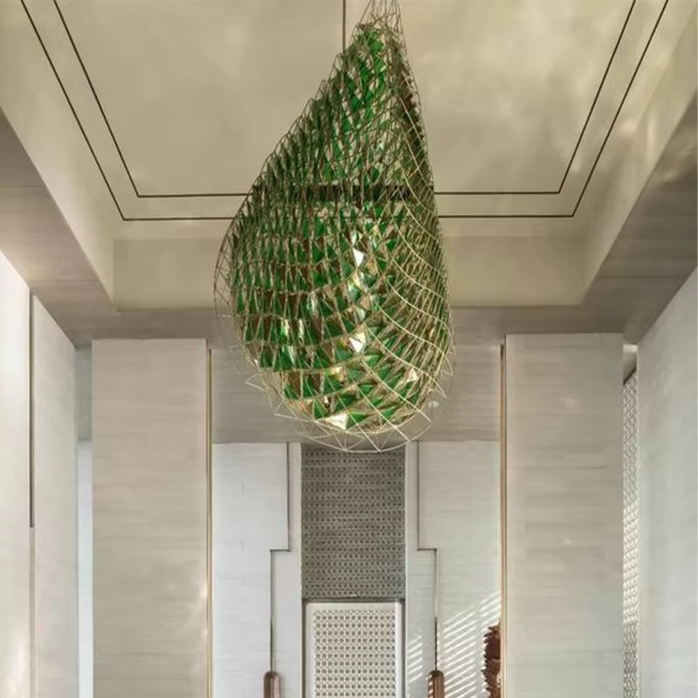 Water-drop shaped light luxury art chandelier with a metal woven frame and green decorative pieces, featuring soft light transmission, designed to enhance the artistic atmosphere of spaces, suitable for high-end indoor scenarios such as hotel lobbies, clubs, and villa entrances
