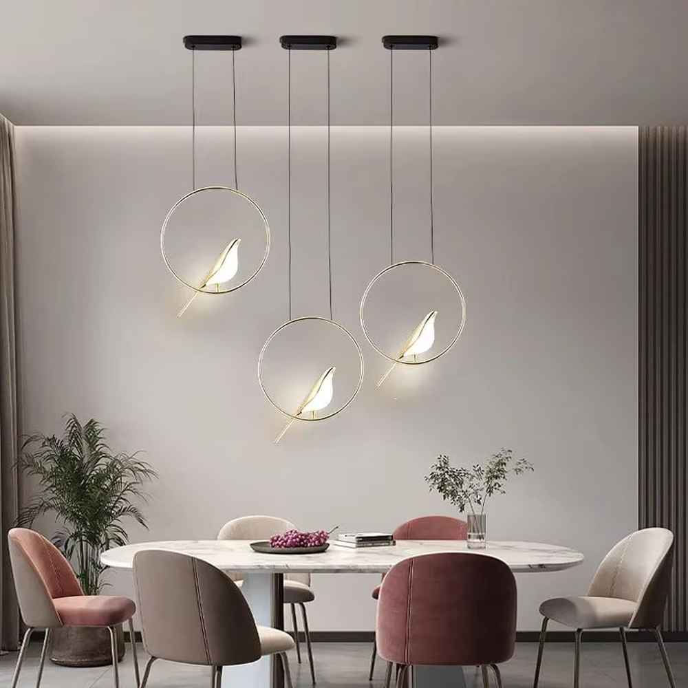 This modern minimalist chandelier features a black metal oval frame, paired with a beveled gold decorative piece and soft LED light source. It has a minimalist and design-conscious shape, serving both lighting and decorative purposes, ideal for modern minimalist spaces such as bedroom bedside tables, living room side tables, and hotel guest rooms.